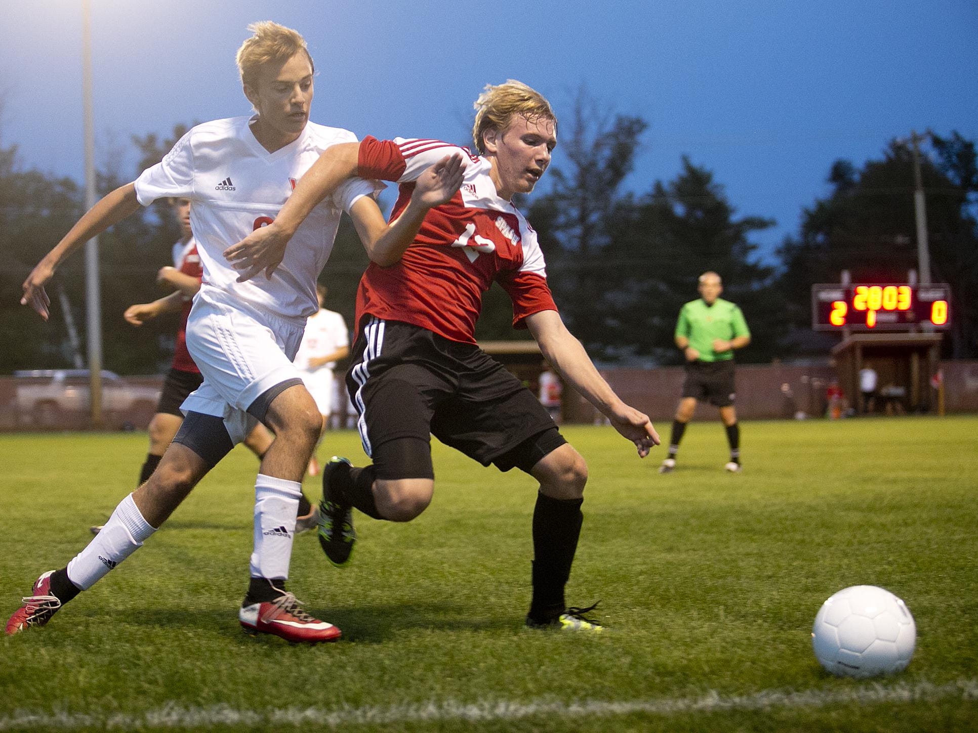 Stevens Point Area Senior High School’s Jordan Schrieber, left, goes against Wisconsin Rapids’ Colin Lindvig during Wisconsin Valley Conference soccer game Tuesday at Washington Field in Wisconsin Rapids.