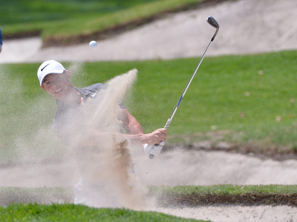 Rory McIlroy plays a shot from a bunker on the first hole during the final round of the WGC - Mexico Championship golf tournament  at Club de Golf Chapultepec in Mexico City.