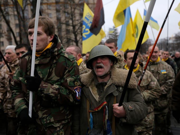 People march in Kiev, Ukraine to commemorate the events
