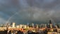 A rainbow emerges over the Chicago skyline.