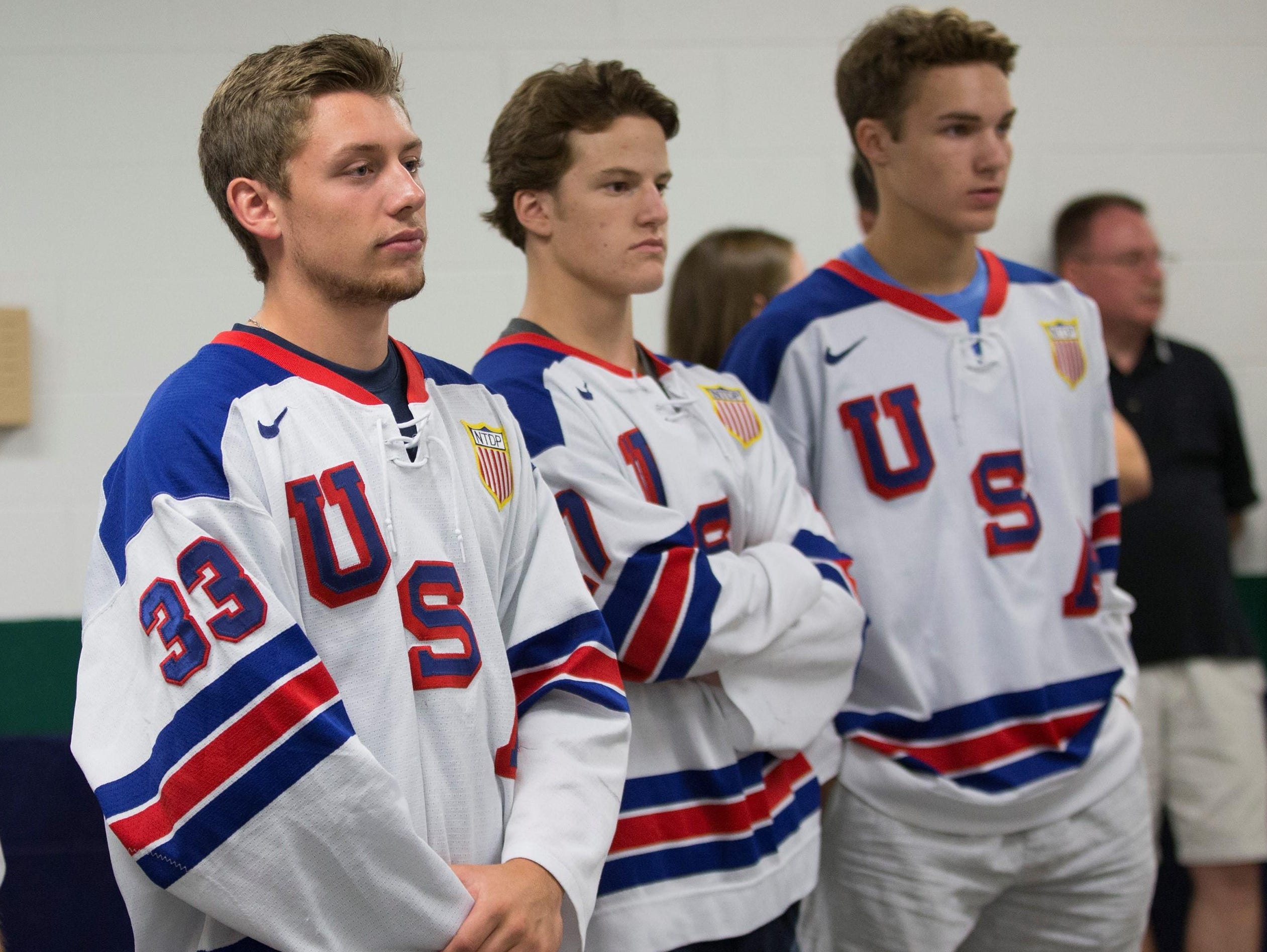 From left, Dylan St. Cyr, Josh Norris and Logan Cockerill are members of the NTDP squads that will play at the USA Hockey Arena in Plymouth.