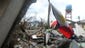 A man searches among the debris of his destroyed house near Tacloban Airport, on the eastern island of Leyte, in the Philippines.