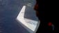 Japan Coast Guard crewman Koji Kubota searches for debris from the missing Malaysia Airlines jet on April 1 near Perth, Australia. Ten planes and nine ships are searching for the missing Boeing 777 that disappeared on March 8.