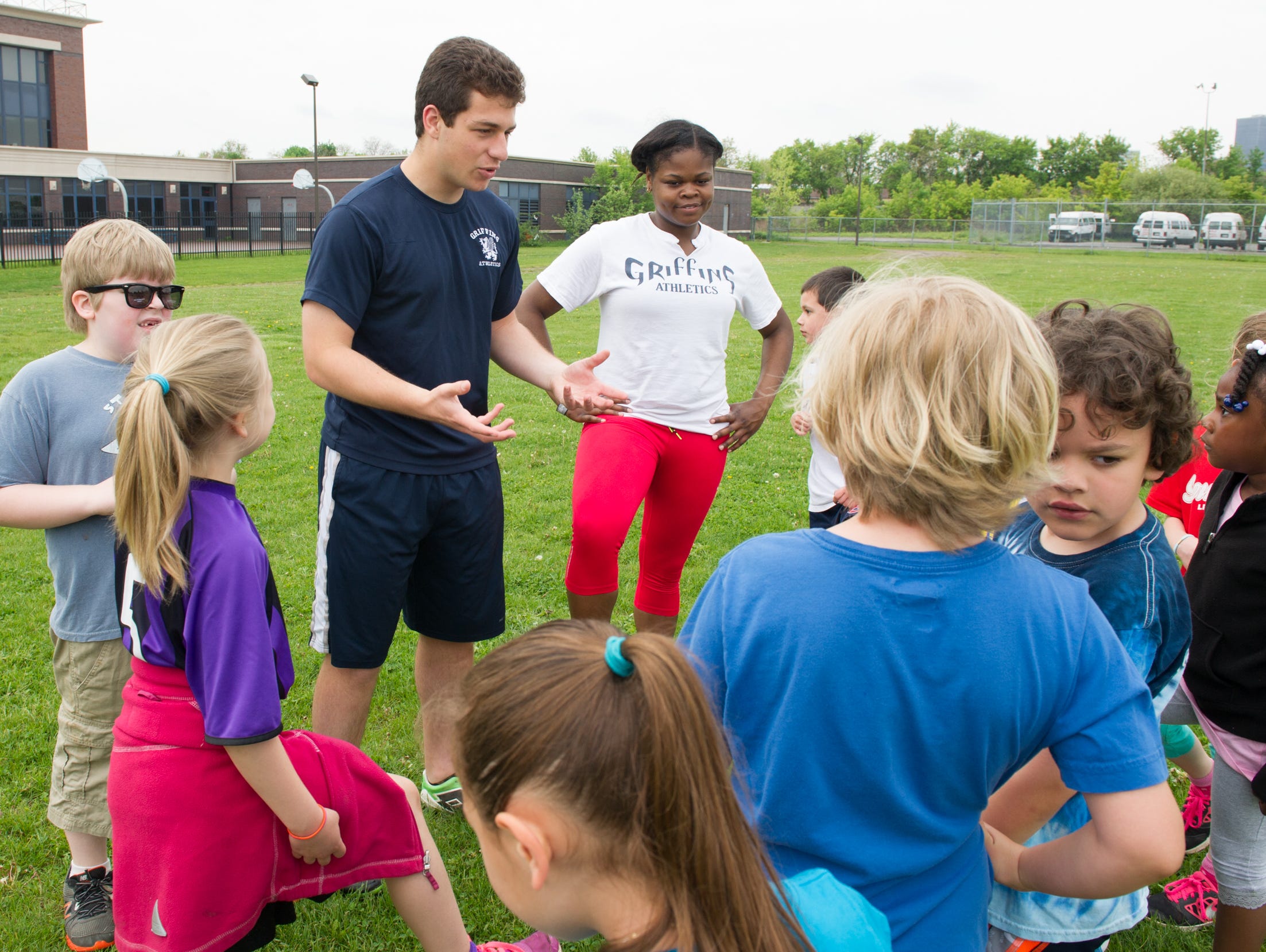 World of Inquiry senior Jason Cherin, 18, of Rochester runs a series of soccer clinics in the city of Rochester for grades K-12. His best friend, senior Quinterra Robinson, 18, of Rochester, right, is one of his assistant coaches.