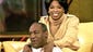 Oprah Winfrey massages Cosby on her show. The comedian