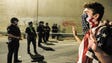 A protester confronts police as protesters shut down
