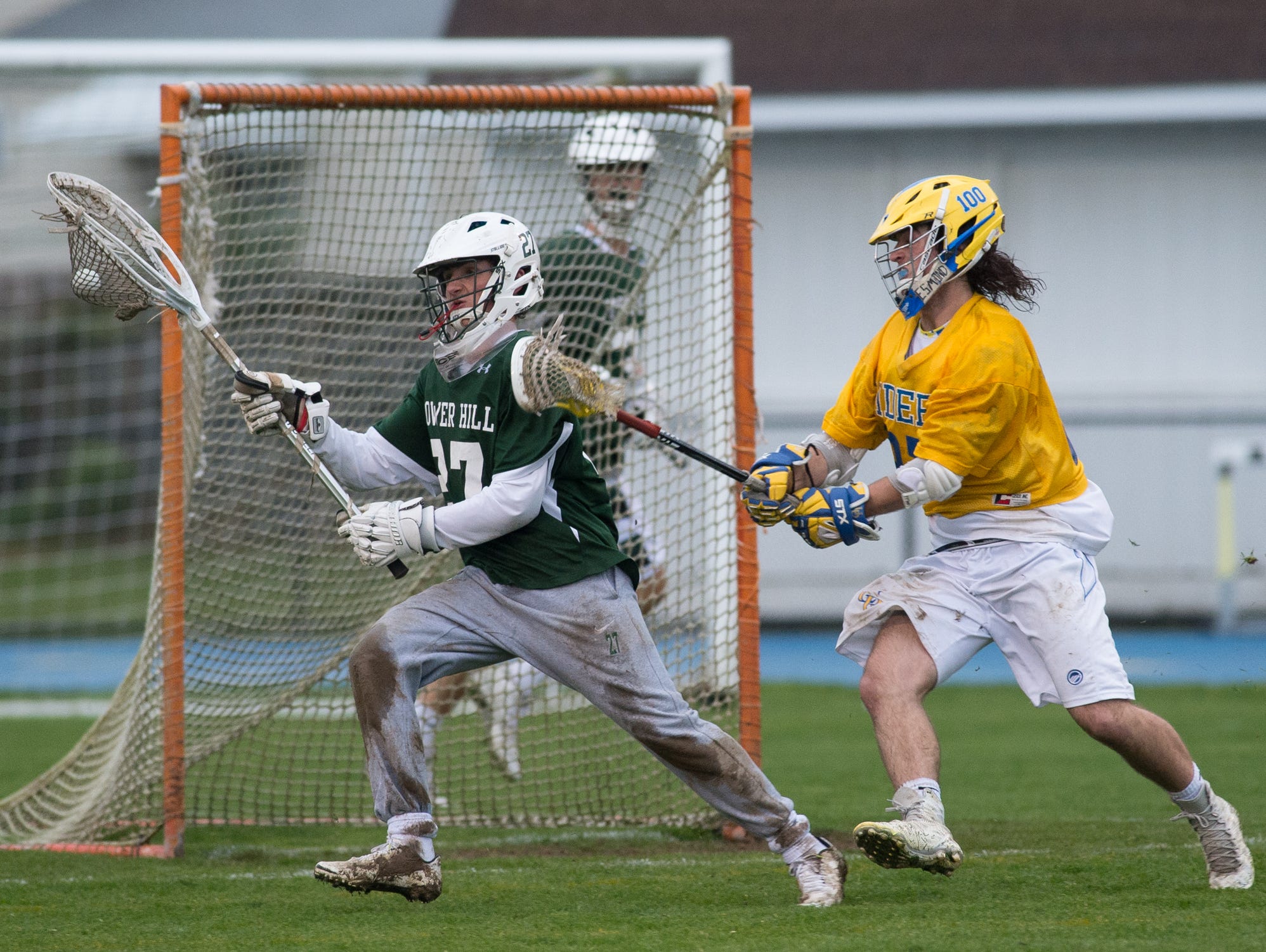 Tower Hill's goalie Michael Gianforcaro (27) keeps the ball away from Caesar Rodney's offense in their 11-9 win.