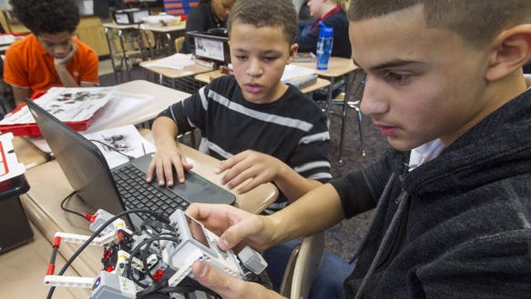 Students work with robots at Ferguson K-8 School in