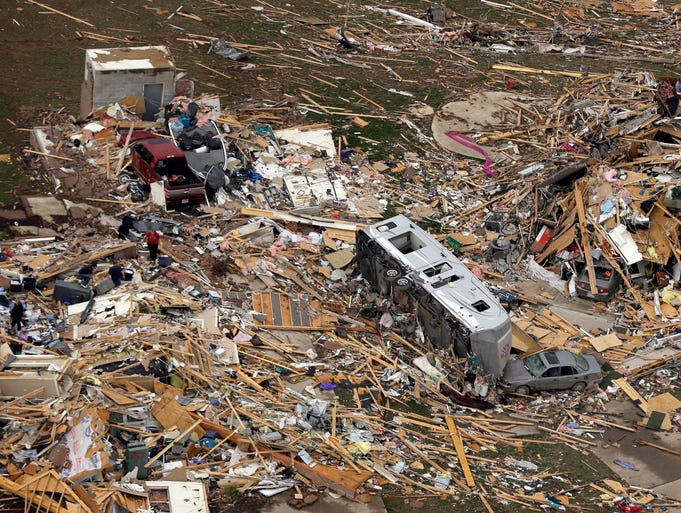 A trailer sits in the wreckage of a home after a tornado in Mayflower.