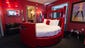 Erotic Suite at The Palms Casino Resort, Las Vegas: This three-tower, off-the-Strip hotel is known for its crazy parties and celebrity stopovers. It features over 400 sleek rooms with up-to-date technologies, but the coolest – or at least the naughtiest – is the Erotic Suite. Kinky couple-friendly amenities include everything from a "show shower" with a stripper pole and nightclub-esque lighting, to a rotating bed underneath a mirrored ceiling. There's also plenty of erotic artwork to spare.