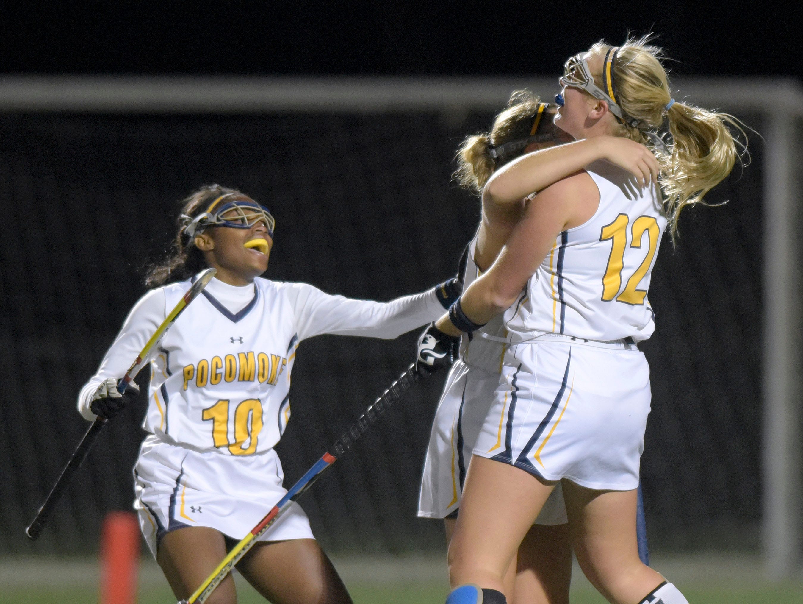 From left, Pocomoke's Shayla Jones, Kasey Lee and Lexi Butler celebrate Lee's goal against Manchester Valley in the second half of a Class 1A state semifinal field hockey game, Wednesday, Nov. 11, 2015 in Burtonsville.