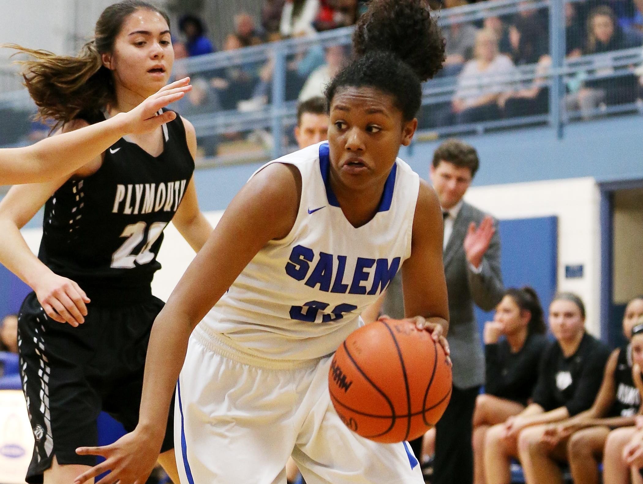 Salem senior Zoe Talley (No. 33) makes an aggressive push toward the basket Tuesday against Plymouth. Talley later left the season opener with a leg injury.