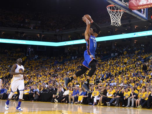 Thunder guard Russell Westbrook dunks against the Warriors