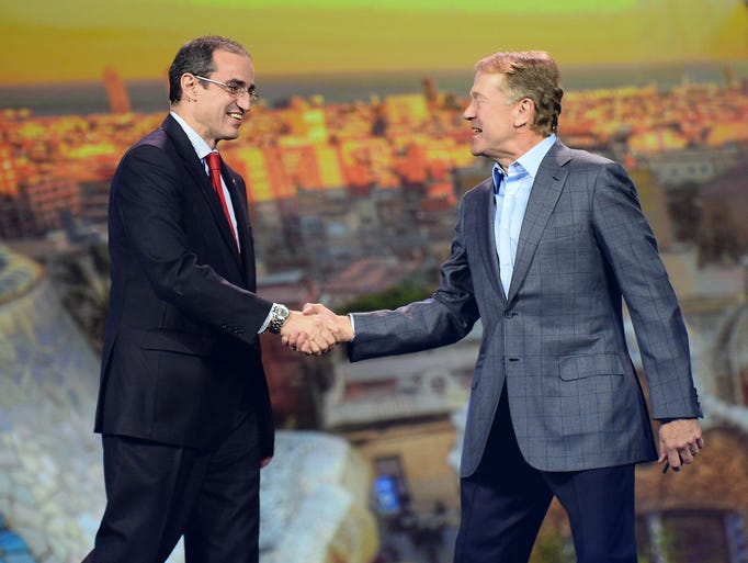 LAS VEGAS, NV - JANUARY 07: Deputy Mayor of Barcelona, Spain Antoni Vives (L) joins Cisco Systems Inc. Chairman and CEO John Chambers as he delivers a keynote address at the 2014 International CES at The Venetian Las Vegas on January 7, 2014 in Las Vegas, Nevada. CES, the world's largest annual consumer technology trade show, runs through January 10 and is expected to feature 3,200 exhibitors showing off their latest products and services to about 150,000 attendees. (Photo by Ethan Miller/Getty Images)