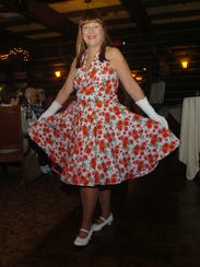 Sue Surletta wore a 1950s floral dress with a “fru-fru