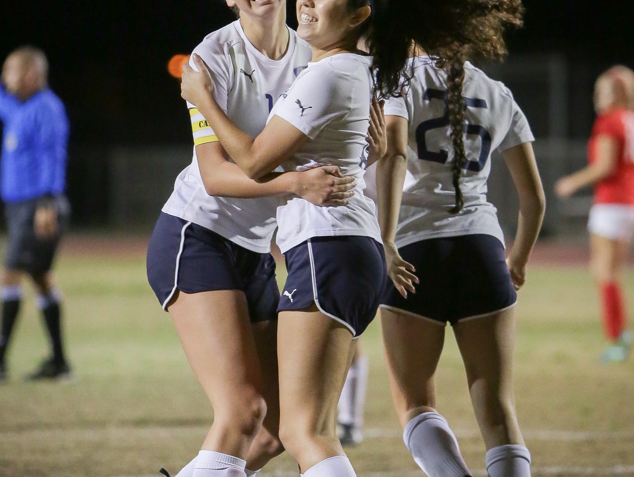 Jaylene Manion celebates with a teammate after scoring for the La Quinta Blackhawks. La Quinta is the top seed in Division 4.