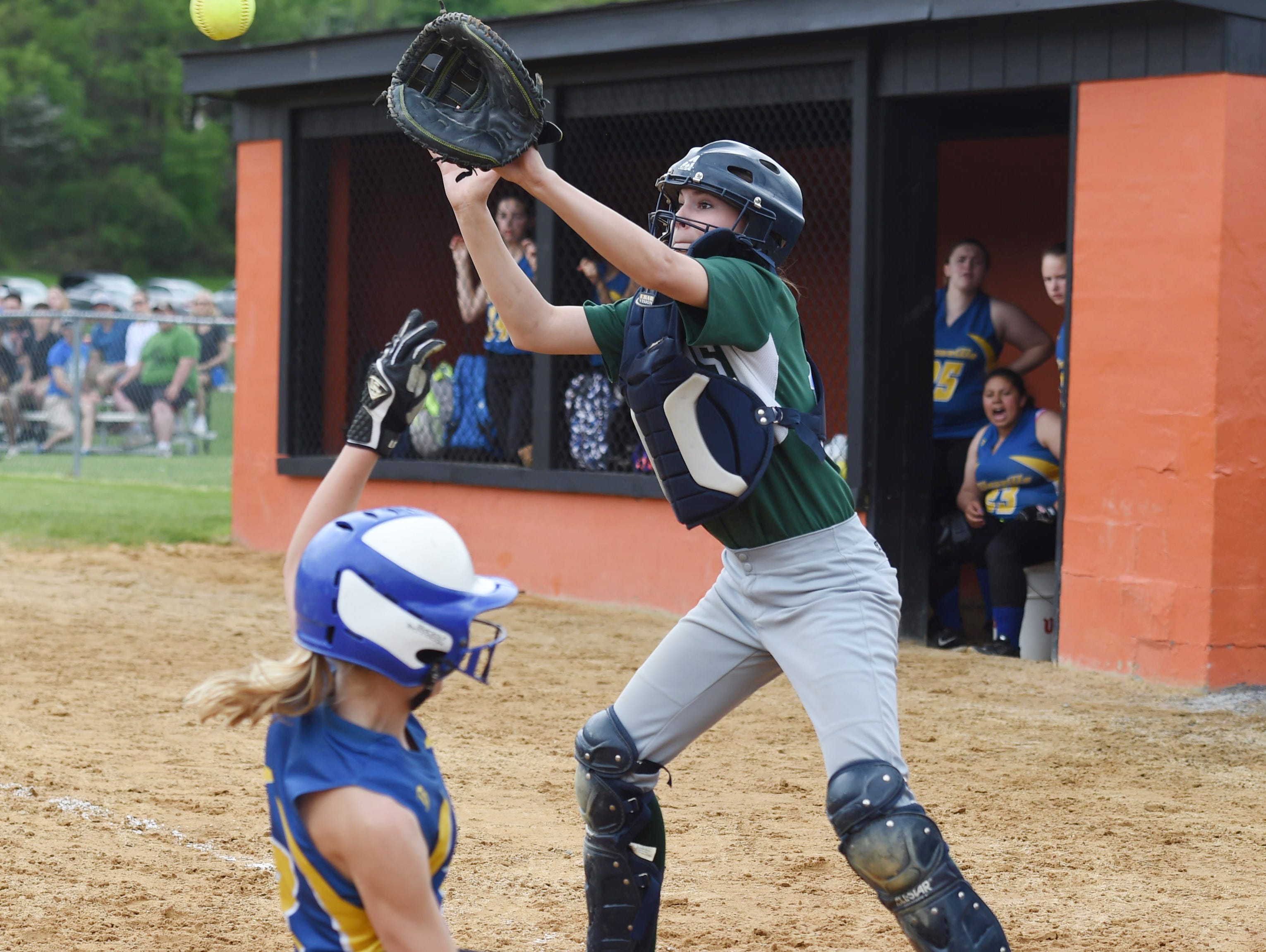 Spackenkill's catcher, Maddie McCall covers home as Ellenville's Kassy Little slides in during Saturday's MHAL Division III title game held at Marlboro.