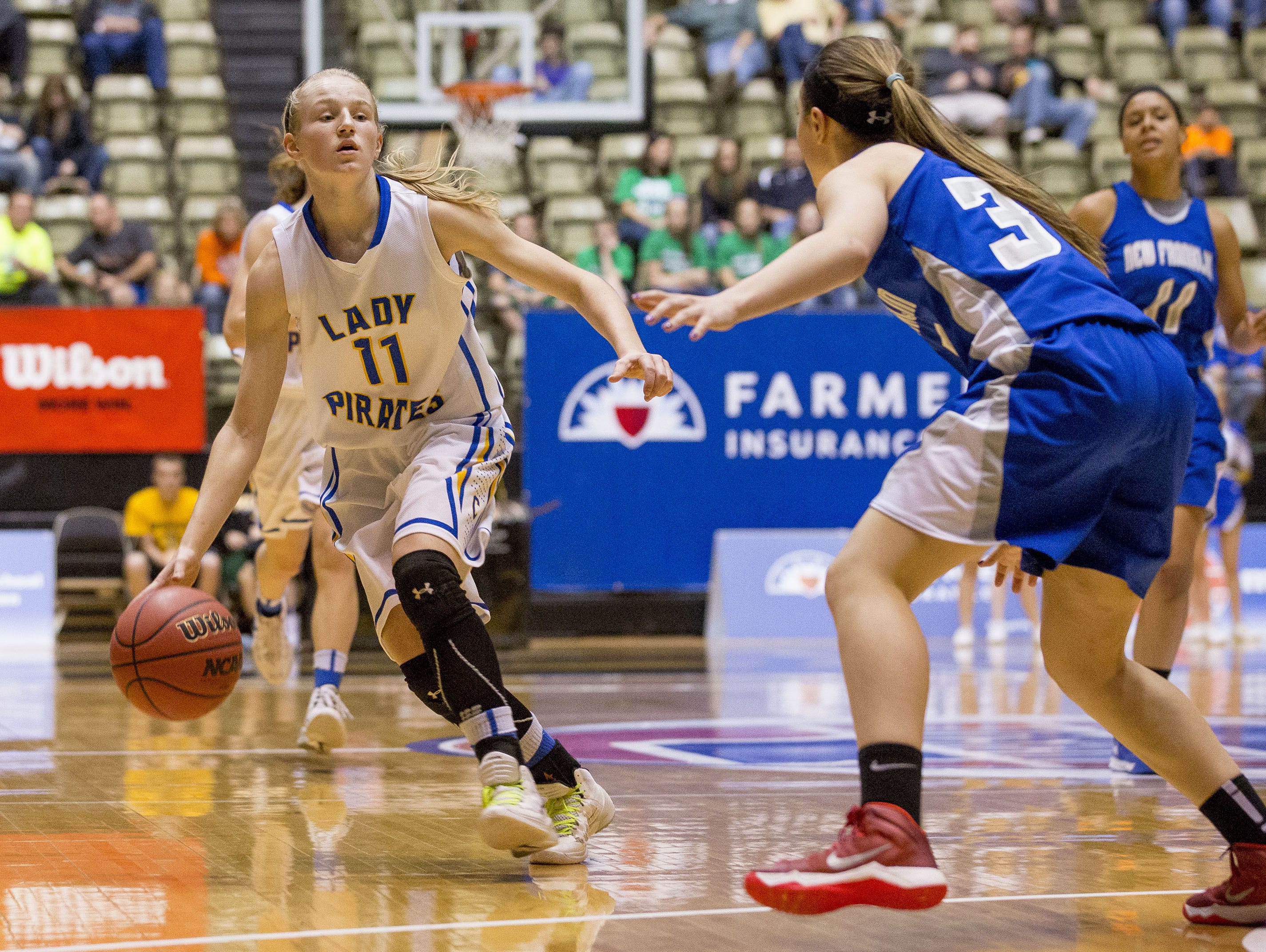 Crane's Lexie Vaught (11) takes the ball up the court.