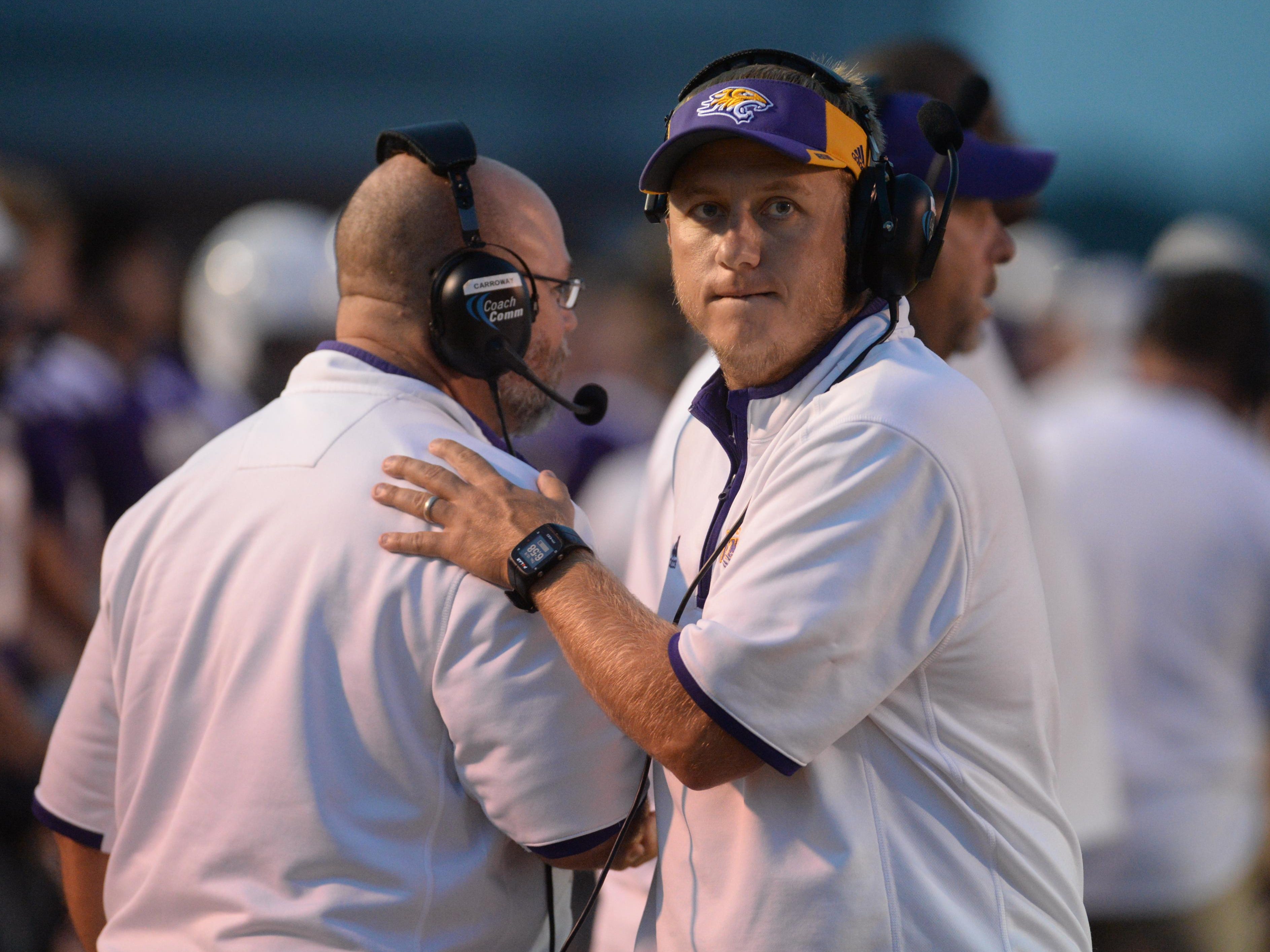 Benton head coach Reynolds Moore walks the sidelines as his team takes on Minden.