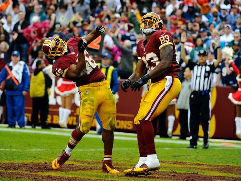 Washington Redskins running back Alfred Morris (46) celebrates after scoring a touchdown against the Dallas Cowboys during the second half at FedEx Field.