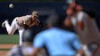 July 17: Padres pitcher Edwin Jackson (left) pitches