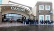 People wait outside del Lago Casino for its grand opening
