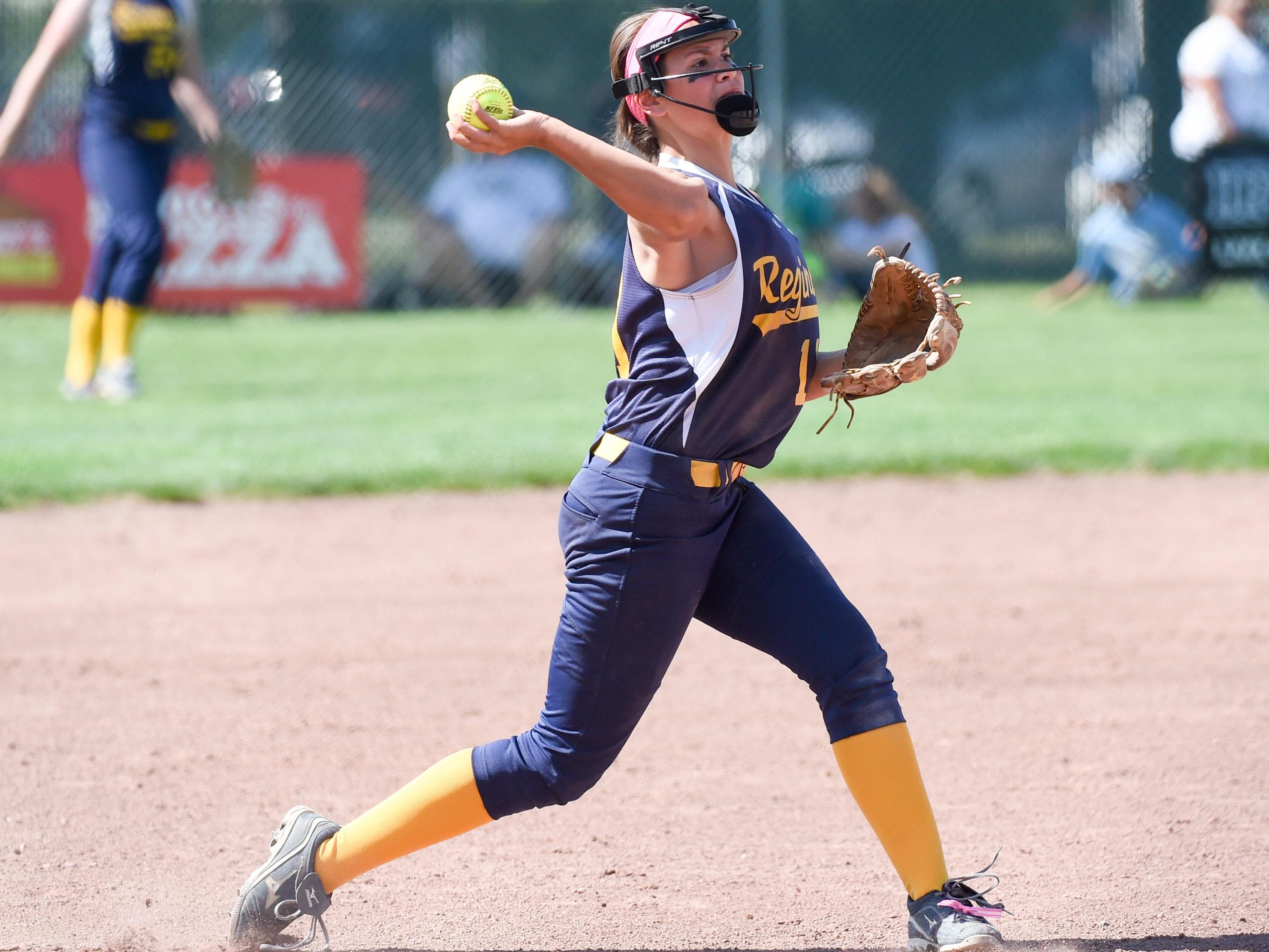 Iowa City Regina third baseman Emily Bonnett (11) makes a throw to first base on Tuesday, July 21, 2015, during the Class 2-A quarterfinals.