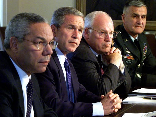 President George W. Bush sits with his National Security