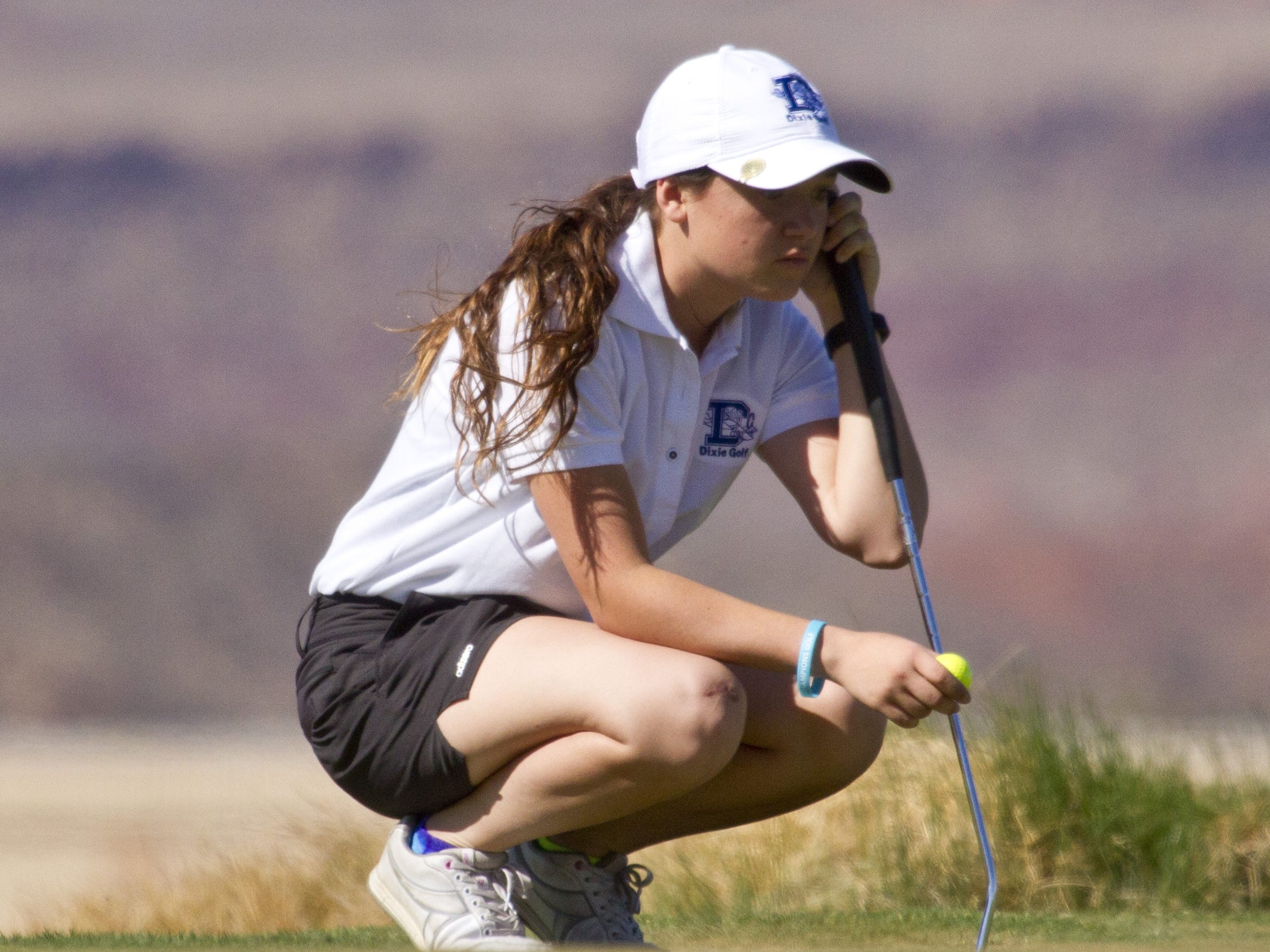 Dixie’s Gracie Richins thinks over a putt at Sand Hollow Thursday, March 19, 2015.