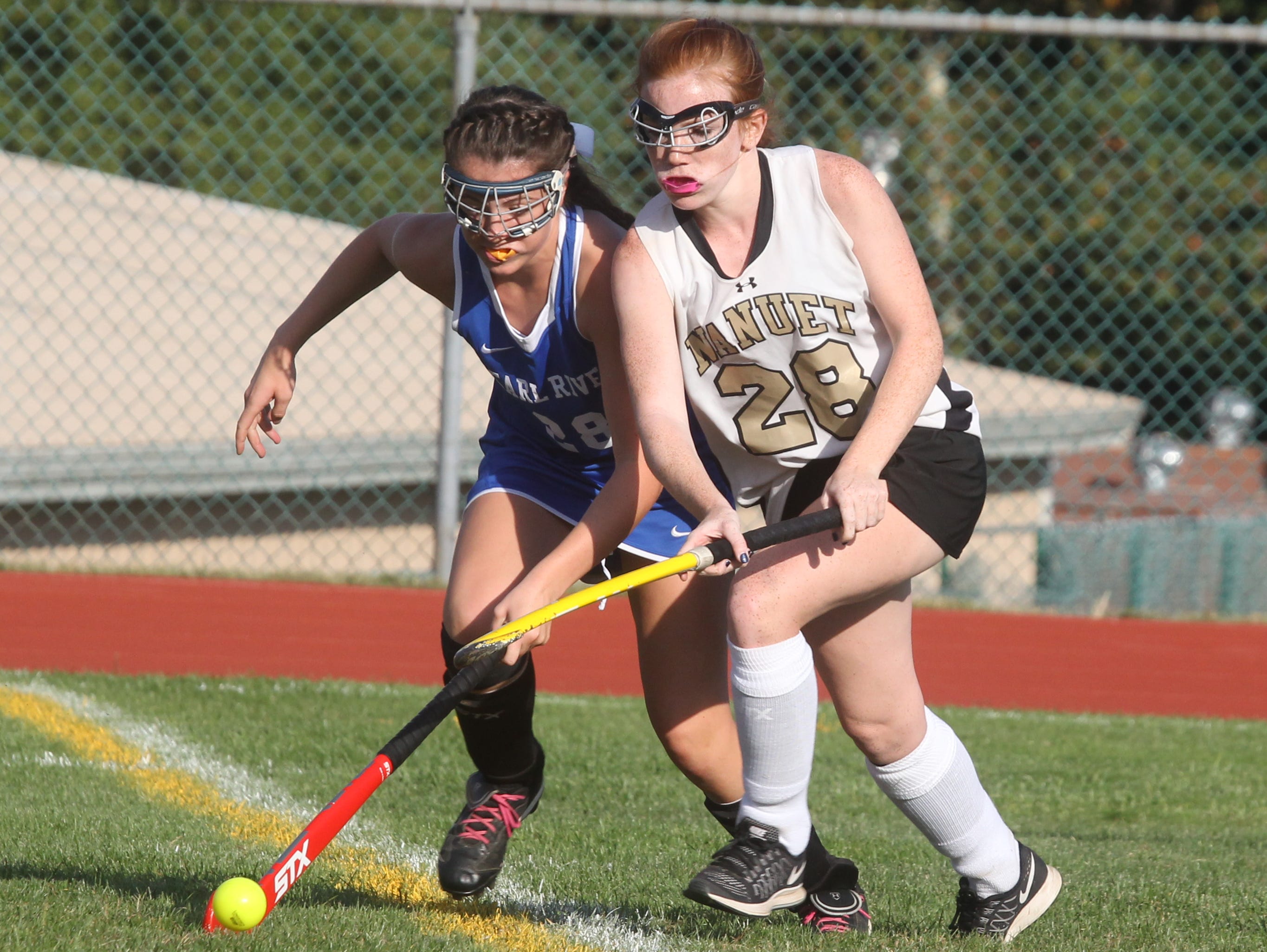 Pearl River's Allison Tarsnane, left, is pressured by Nanuet's Alex Ryan during their game at Nanuet on Friday. The game ended in a 0-0 tie.