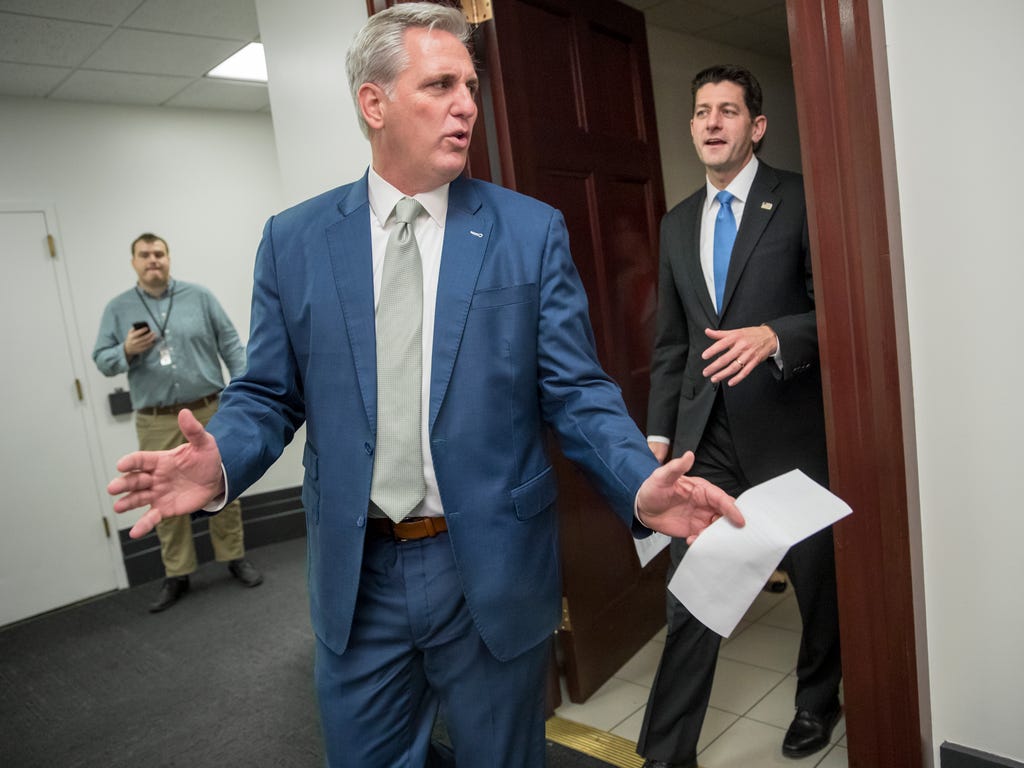 Majority Leader Kevin McCarthy, R-Calif., left, and Speaker of the House Paul Ryan, R-Wis., leave a closed-door Republican Conference meeting as Congress prepares to vote on the biggest reshaping of the U.S. tax code in three decades, on Capitol Hill