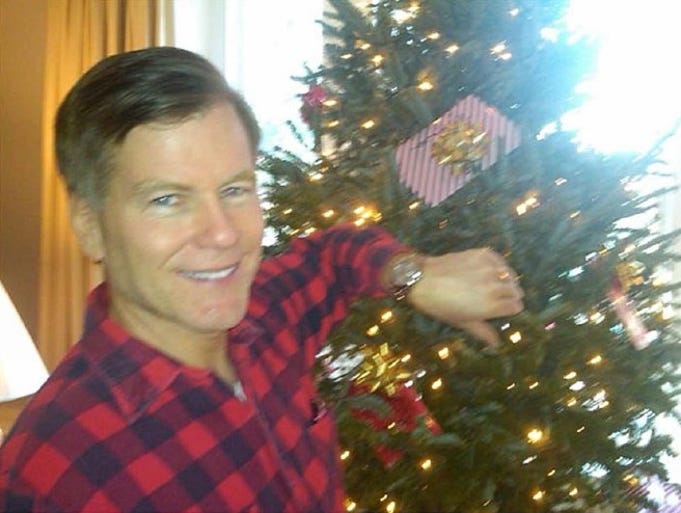Bob McDonnell wearing his Rolex in front of a Christmas tree
