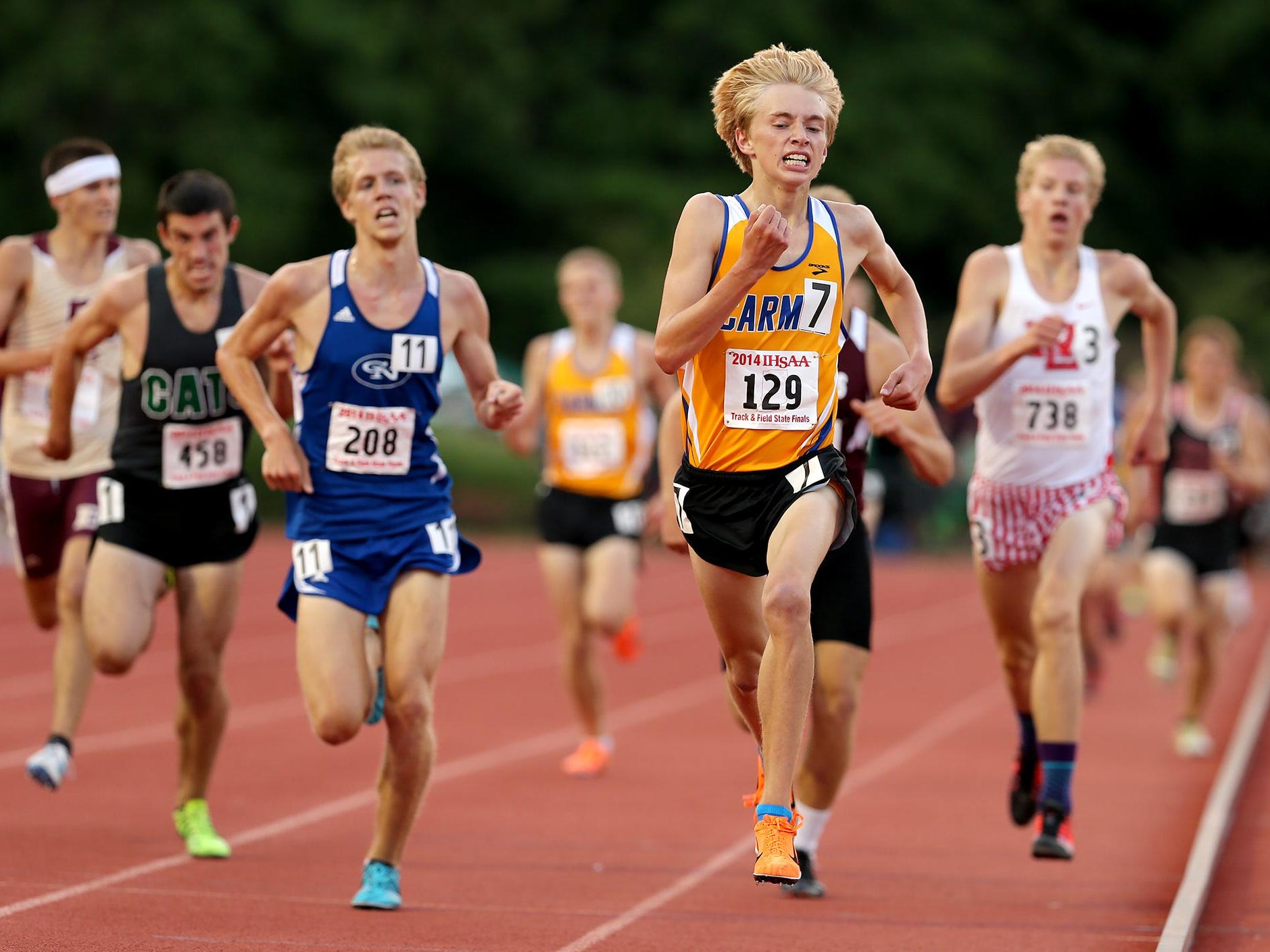 Carmel's Ben Veatch holds off the field to finish second in the 3200 meter run during the 111th annual Boys Track & Field State Finals, Saturday, June 7, 2014, at Indiana University's Robert C. Haugh Track & Field Complex.