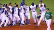 March 9: Italy players celebrate a walk-off, 10-9 win,