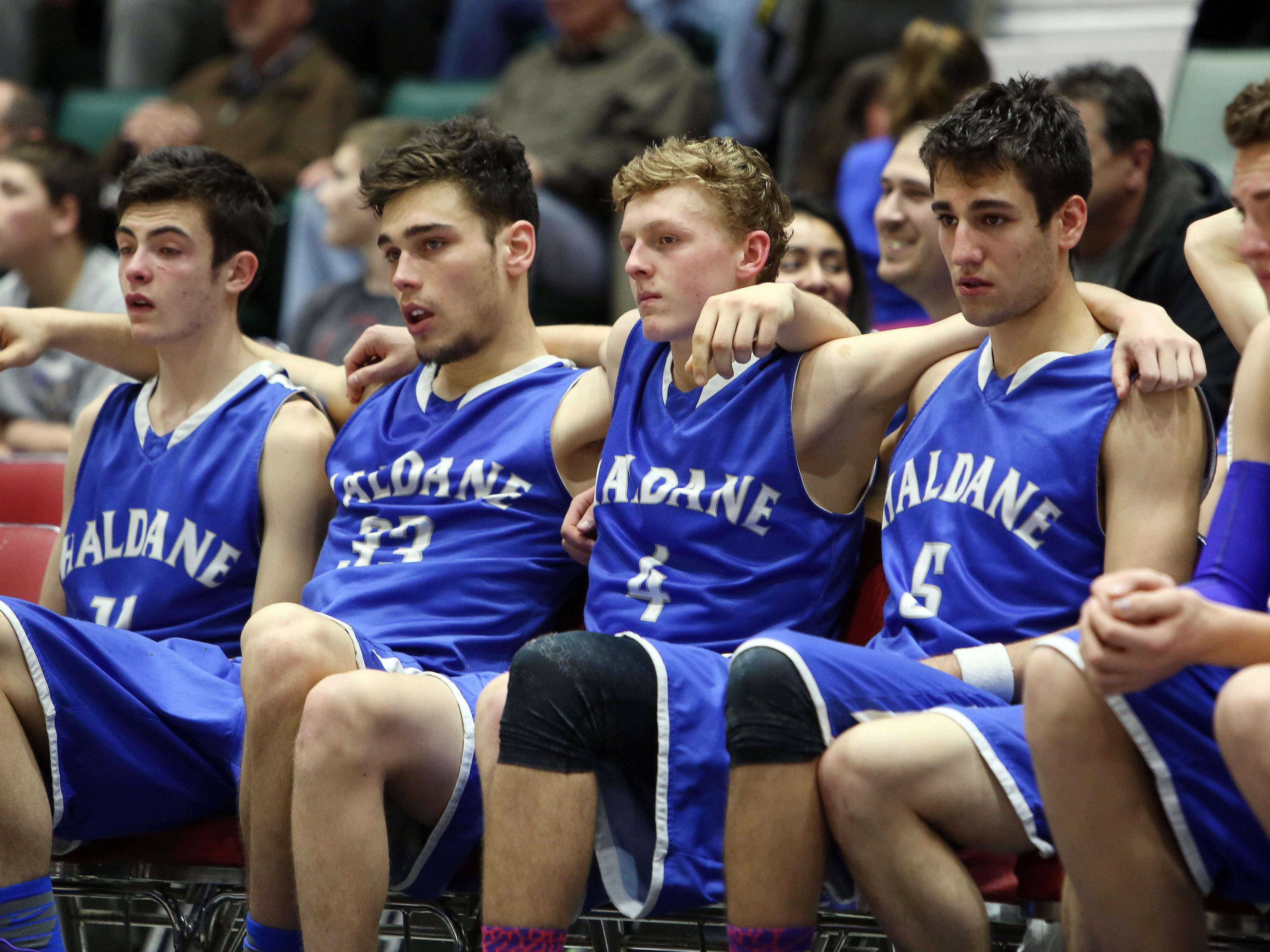 Haldane starters watch from the bench as their season comes to an end with an 82-40 loss at the hands of Middle Early College during the Class C state championship game at the Glens Falls Civic Center Saturday.