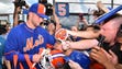 Sept. 19: Tim Tebow signs autographs for fans after