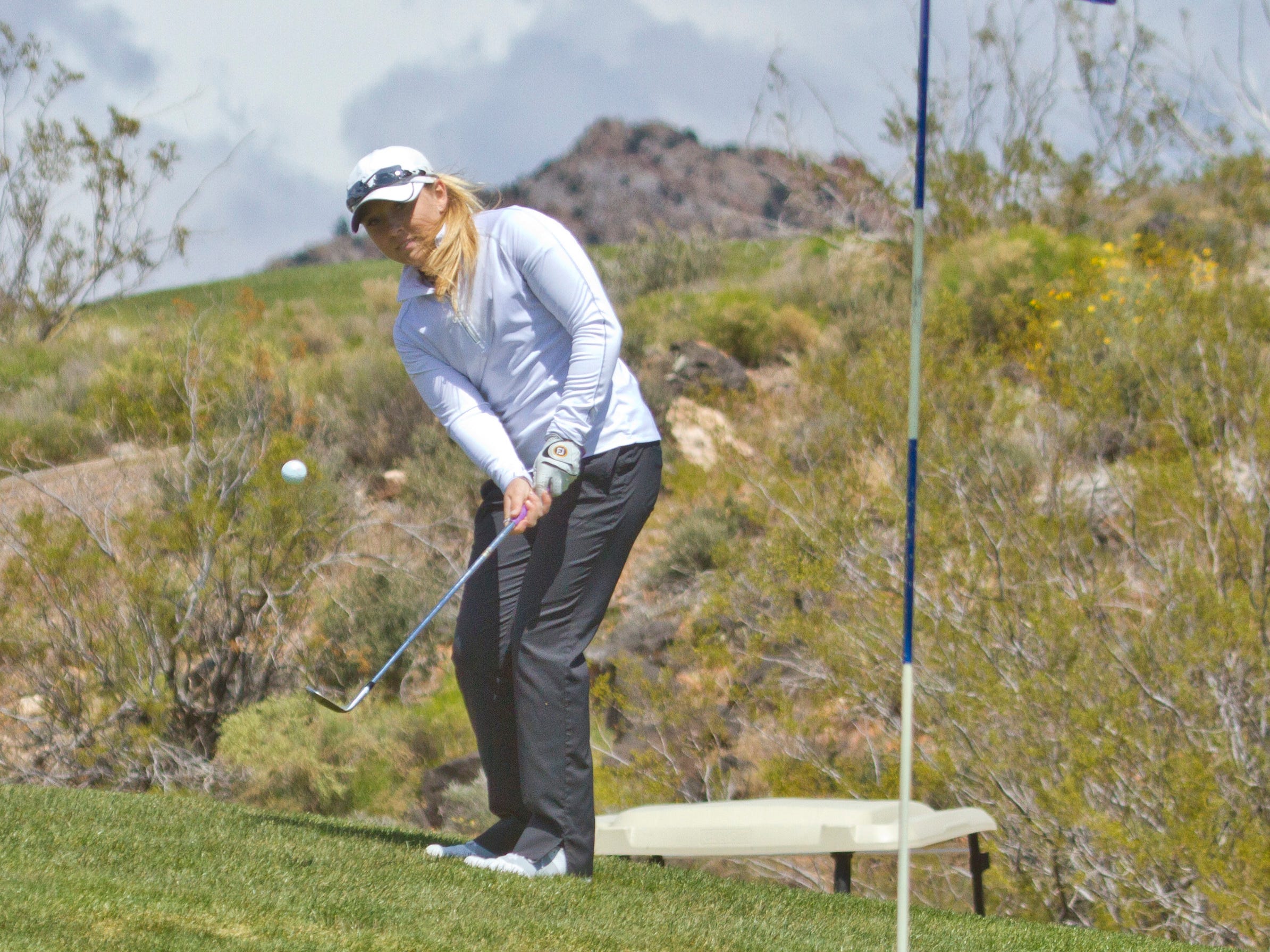 Pine View golfer Taylor Bandley ships on the green at Sky Mountain Thursday, April 16, 2015.
