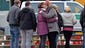 Two girls hug in front of the Joseph-Koenig-Gymnasium