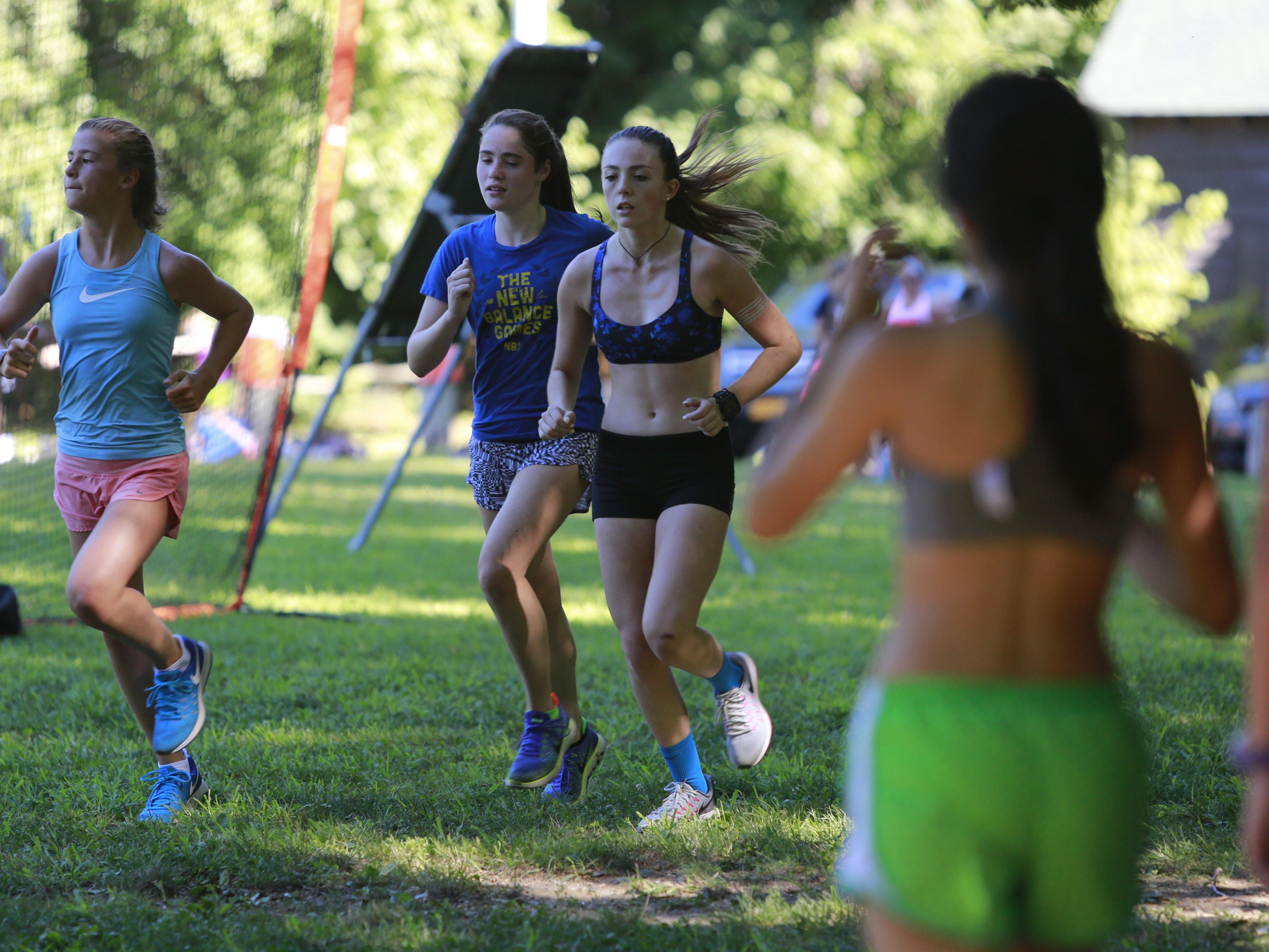 Members of the Bronxville Cross Country Track Cross Country team train at Scout Field in Bronxville on Aug. 23, 2016.