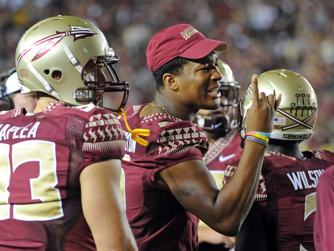 Suspended for a game against Clemson, Winston watches the Seminoles rally for an overtime win.