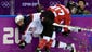 Canada defenseman Tara Watchorn (27) is called for a woman body checking penalty against USA defenseman Megan Bozek (9) in the first period in the women's ice hockey gold medal game.