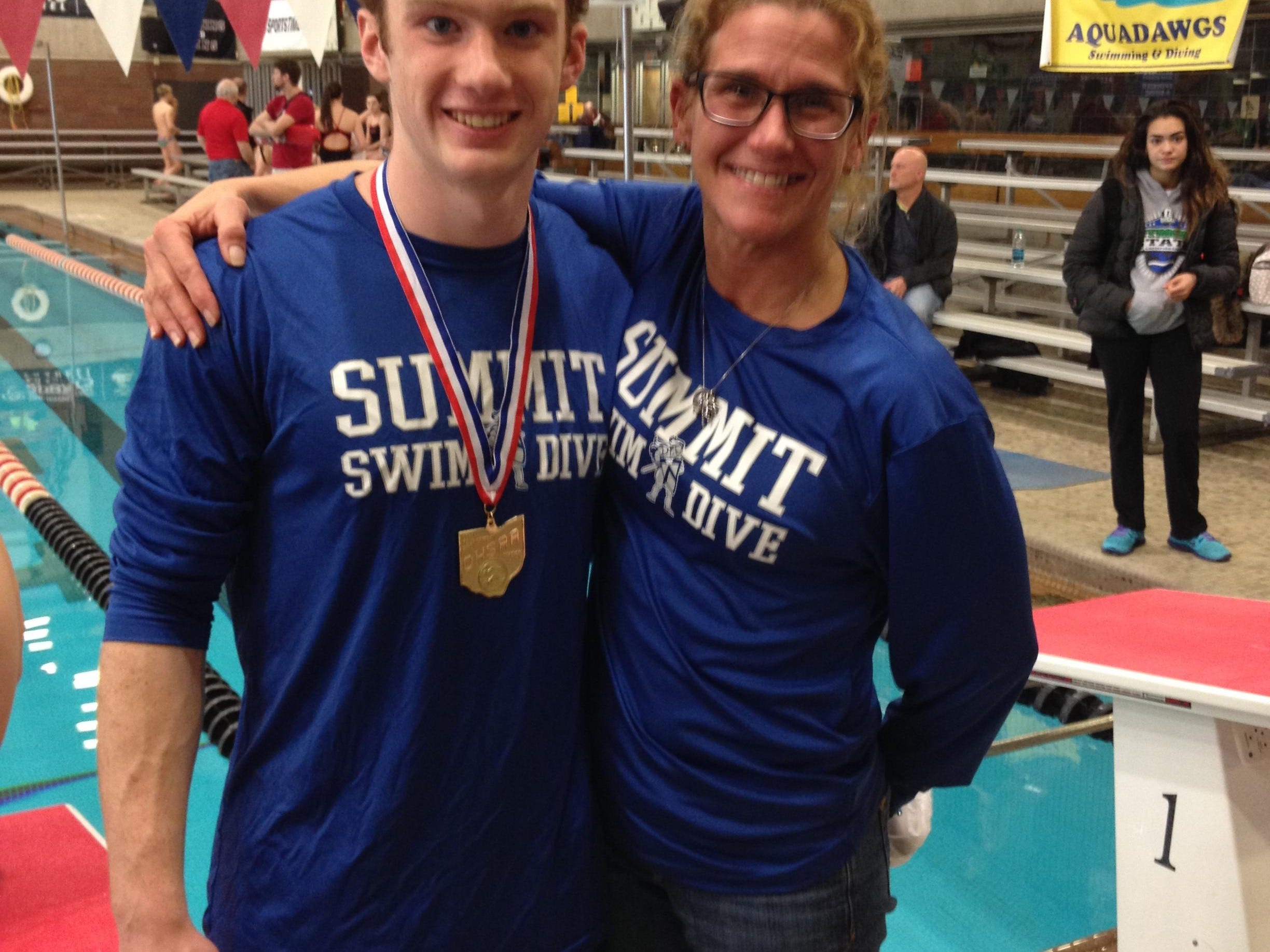 Summit Country Day’s newest state champion Stewart Spanbauer celebrates with his diving coach Lori Rapp after winning the the 2015 1-meter diving title. Rapp was recently inducted into the LaRosa’s High School Sports Hall of Fame for her diving and coaching accomplishments.