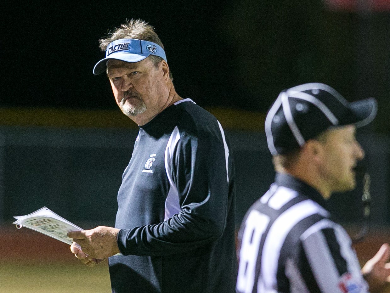 Glendale Cactus head coach Larry Fetkenhier at their high school football game against Queen Creek in Queen Creek on Friday, November 8, 2013.