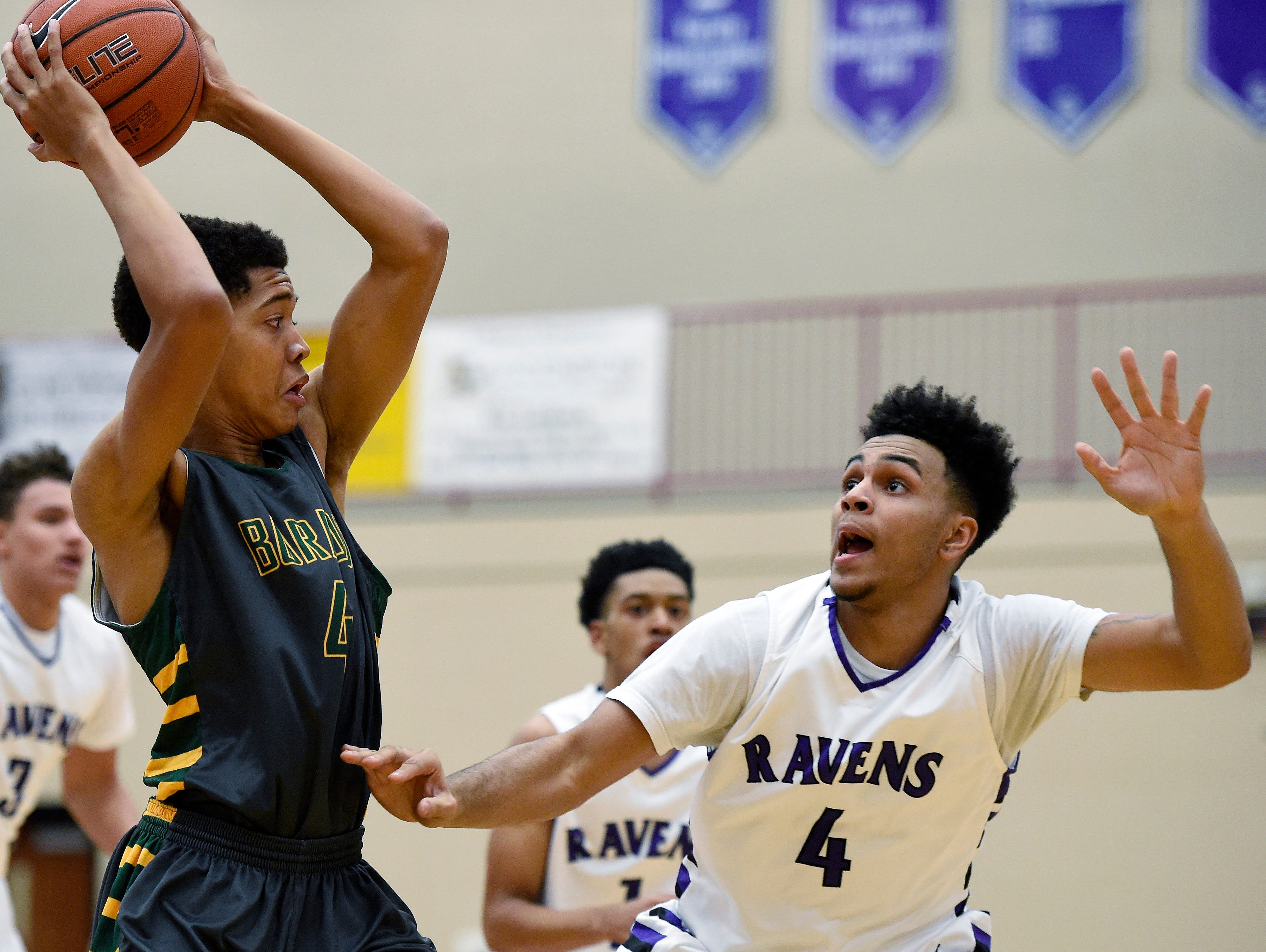 Hillsboro's Collin Herron (4) passes over Cane Ridge's Shawn Pirtle (4) during the first half at Cane Ridge High School, Friday, Feb. 5, 2016, in Nashville, Tenn.Cane Ridge's Hillsboro's during the first half at Cane Ridge High School, Friday, Feb. 5, 2016, in Nashville, Tenn.