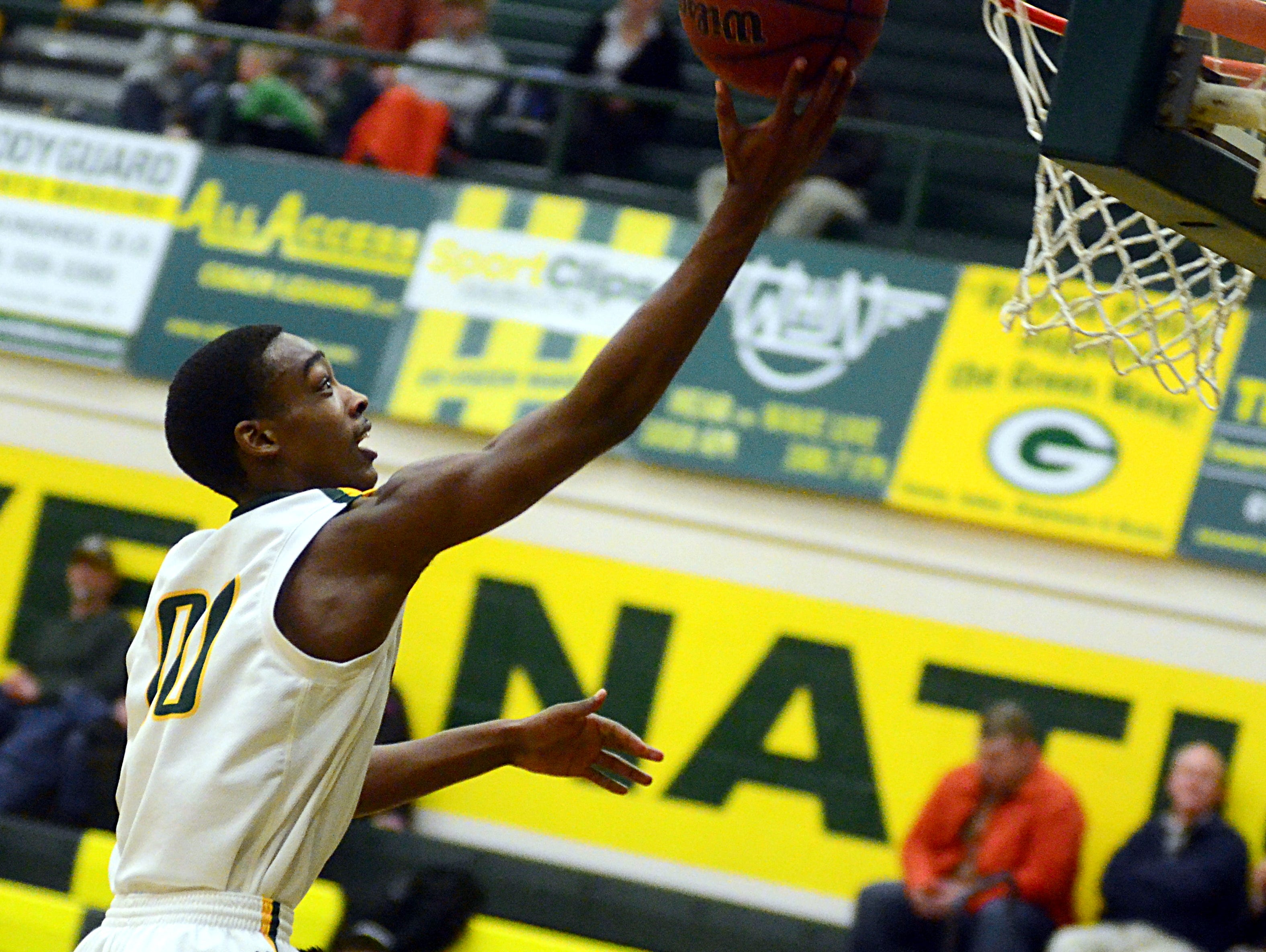 Gallatin High junior Marlon Mitchell elevates for a layin during second-quarter action. Mitchell scored eight points.
