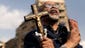 An Egyptian protester chants slogans against President Mohammed Morsi as he holds a cross and Quran on Nov. 23, 2012, in Tahrir Square. Morsi had given his office sweeping new legislative powers, putting himself above the judiciary and also exempting the Islamist-dominated constituent assembly -- the one writing Egypt's new constitution -- from judicial review.