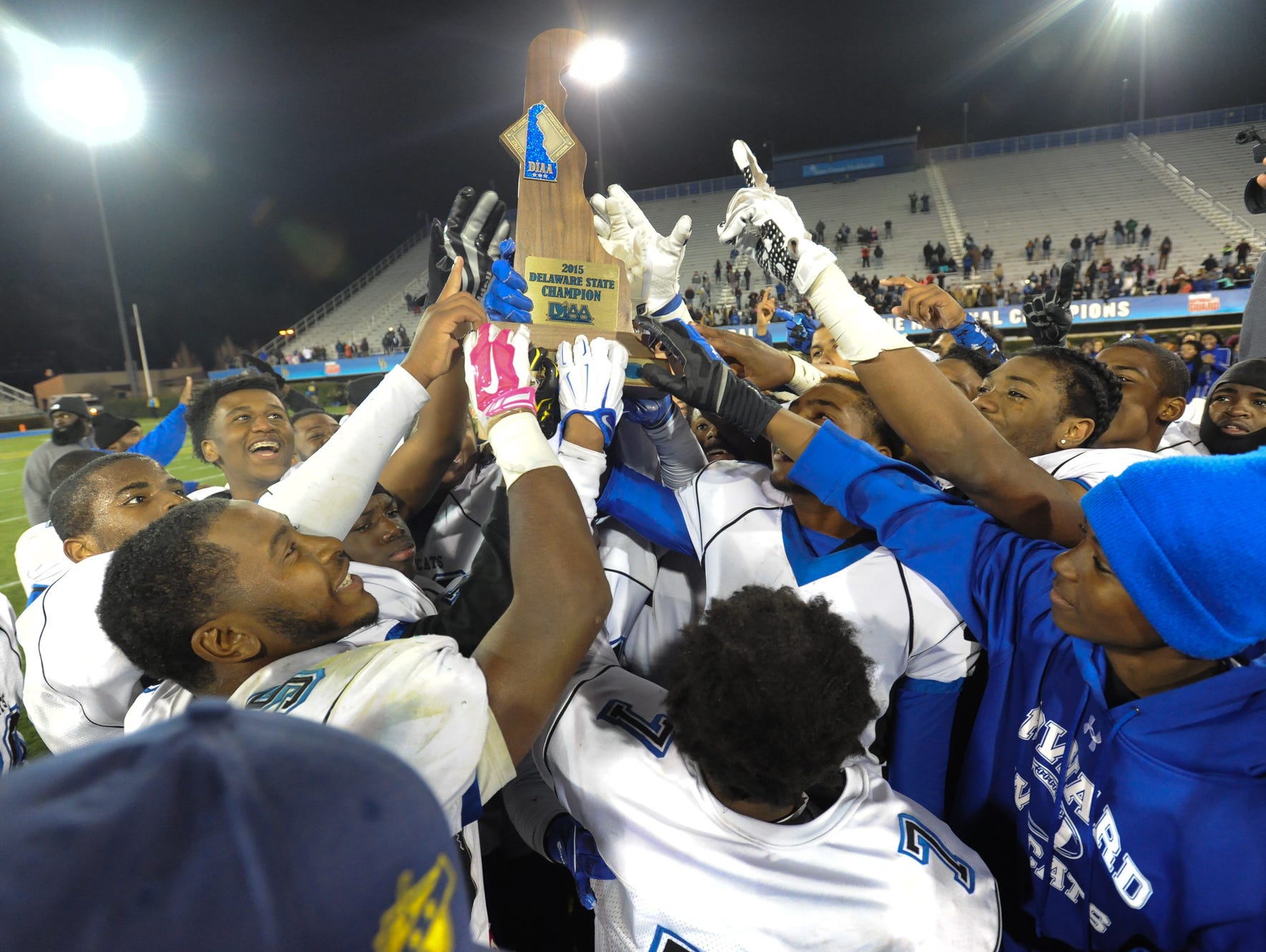 Howard players celebrate their 28-13 win over St. Georges in the DIAA Division II championship game Saturday night at Delaware Stadium.