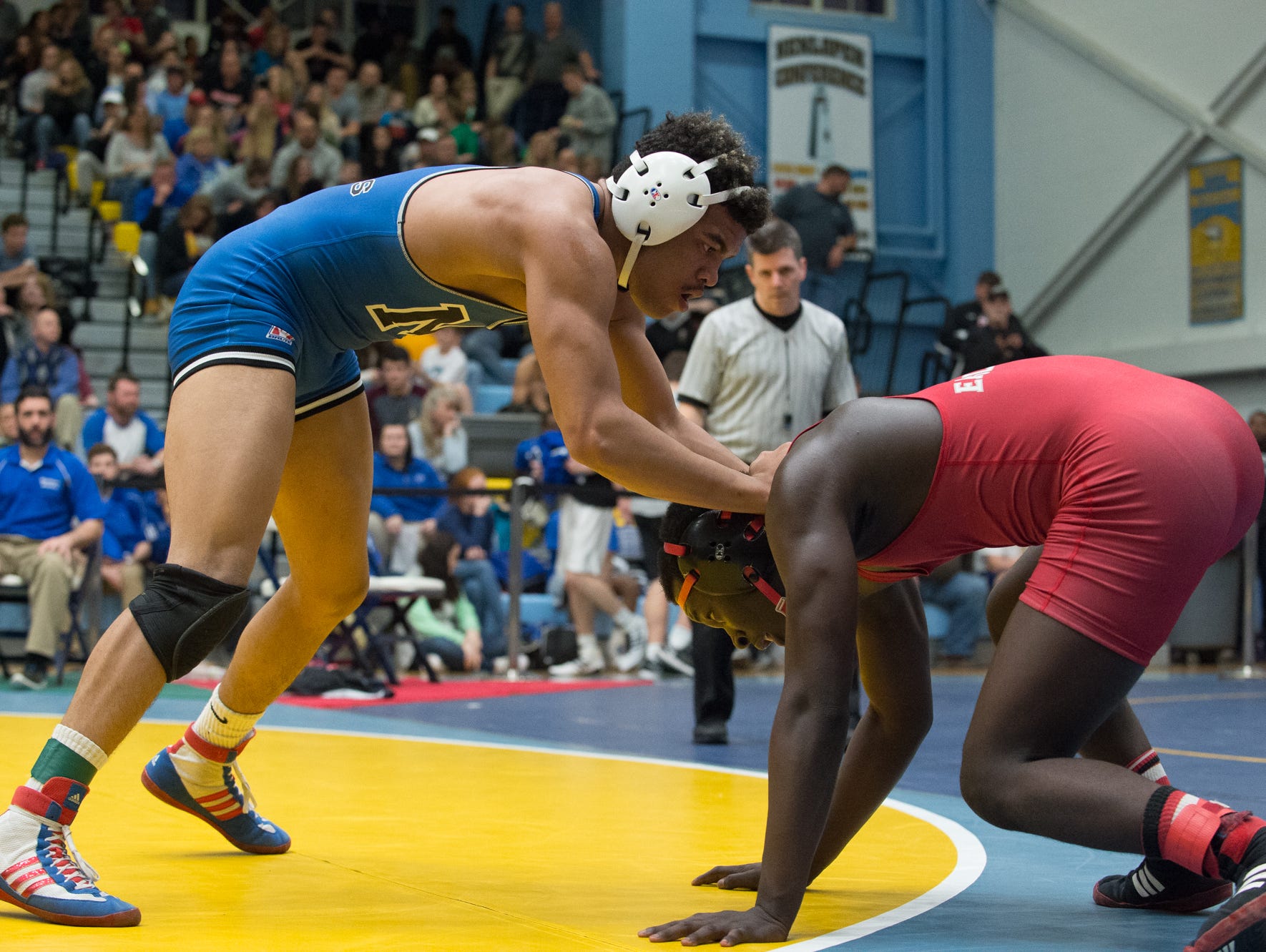 Middletown's Isiah Mitchell, left tries to hold down Smyrna's Larsen Wilson in the 170 pound quarterfinals at the DIAA Individual State Tournament at Cape Henlopen High School.