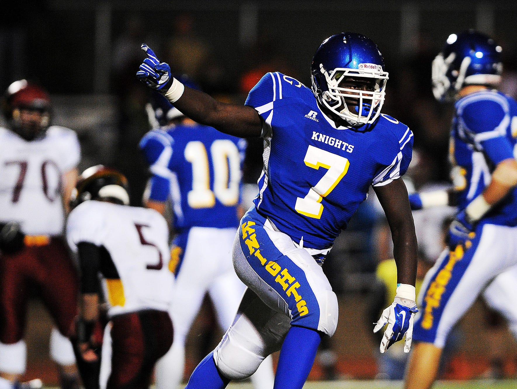 O'Gorman's Jimmy Pio (7) reacts after the Knights recovered a fumble during a game against Roosevelt on Friday, Oct. 17, 2014, at McEneaney Field on the O'Gorman High School campus in Sioux Falls, S.D.
