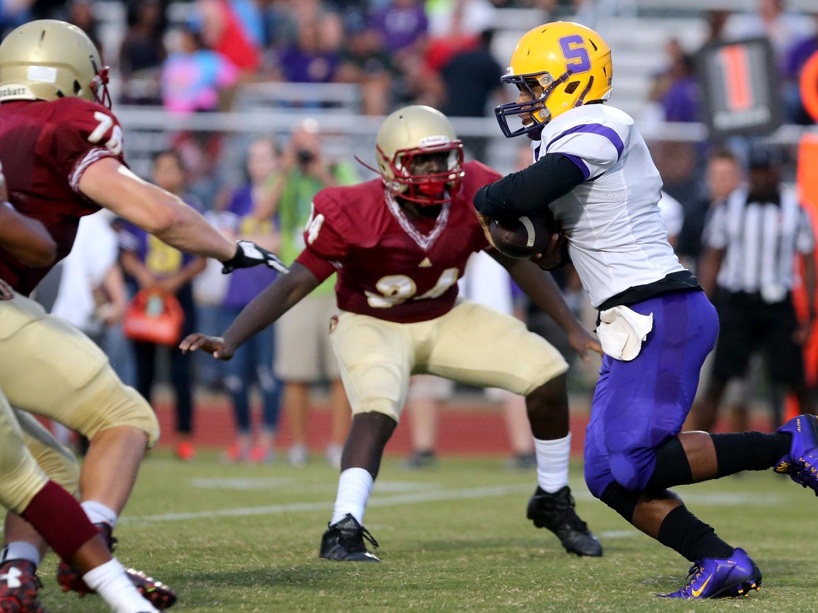 Smyrna's Casey Perkins runs the ball against Riverdale in the second Jamboree game Friday, Aug. 14, 2015, at Stewarts Creek.